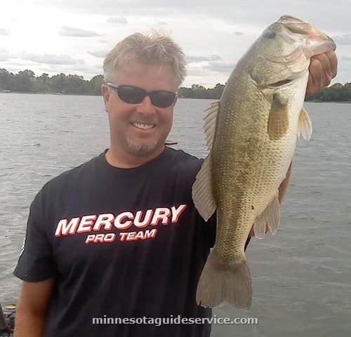 Client with bass on guided trip